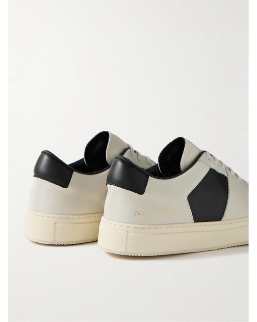 Sneakers in pelle bicolore Decades di Common Projects in White da Uomo