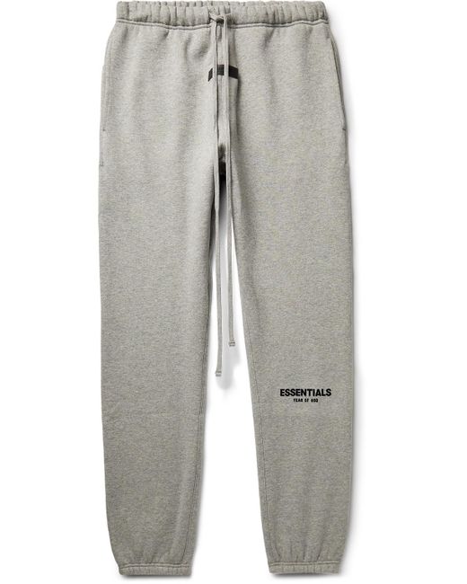 Fear of God ESSENTIALS Tapered Logo-flocked Cotton-blend Jersey Sweatpants  in Gray for Men | Lyst