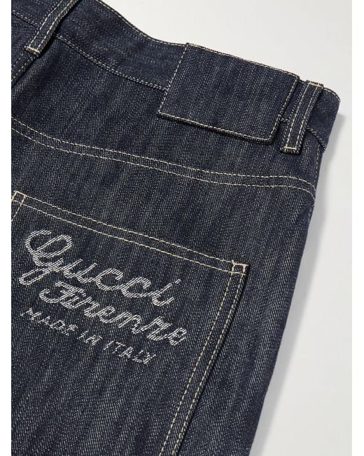 Jeans a gamba larga con logo jacquard di Gucci in Blue da Uomo