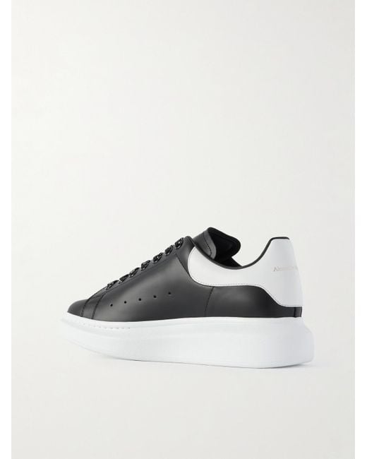 McQueen Black Exaggerated-Sole Studded Leather Sneakers for men