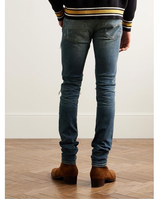 Amiri MX1 Skinny Jeans mit Einsätzen in Distressed-Optik in Blue für Herren