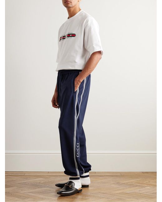 Pantaloni sportivi a gamba affusolata in jersey con righe e logo di Gucci in Blue da Uomo