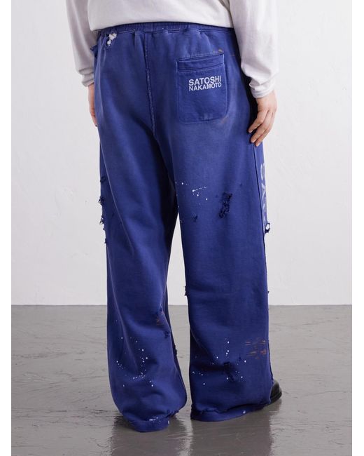 Satoshi Nakamoto Blue Luke Logo-Printed Paint-Splattered Distressed Cotton-Jersey Drawstring Sweatpants for men
