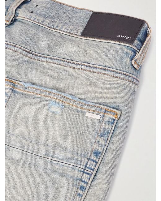 Amiri Blue Slim-fit Appliquéd Distressed Jeans for men