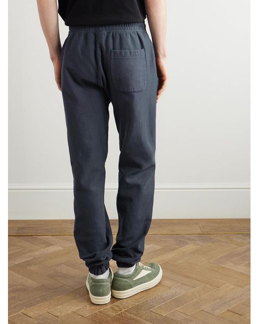 SAINT Mxxxxxx Blue Tapered Logo-Print Cotton-Blend Jersey Sweatpants for men