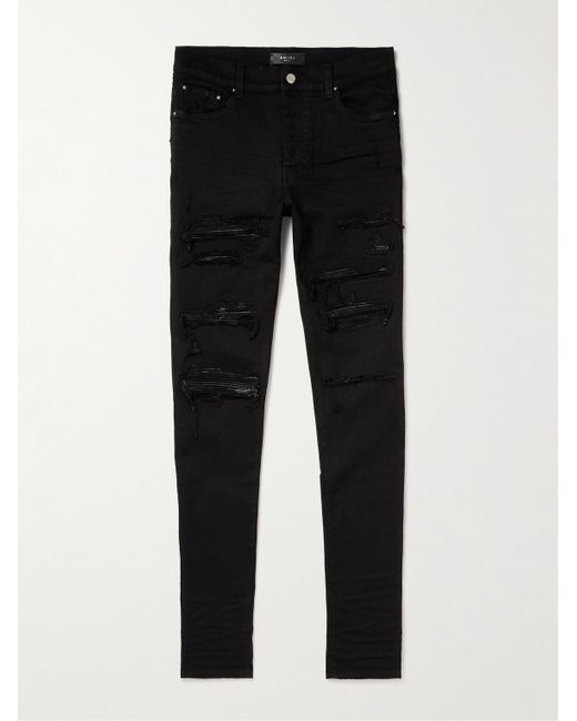 Jeans skinny effetto consumato con inserti in pelle Thrasher di Amiri in Black da Uomo