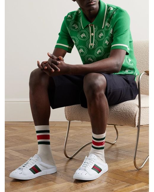 Sneakers slip-on in gomma con nastro Web e dettaglio traforato Ace di Gucci in White da Uomo