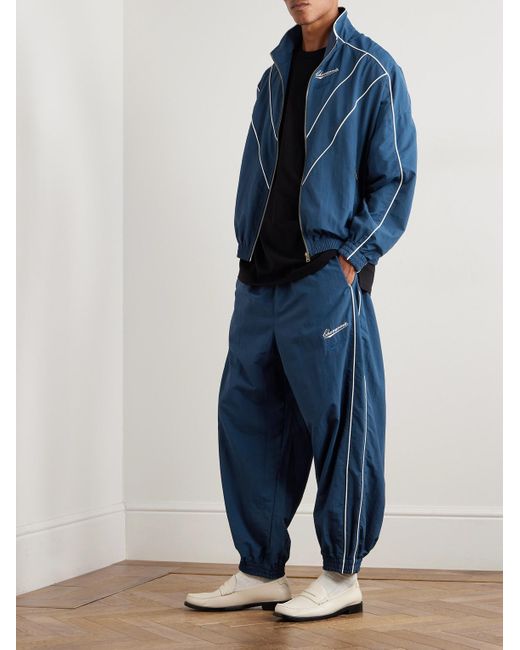 Willy Chavarria Blue Bad Boy Tapered Logo-Embroidered Piped Shell Trackpants for men