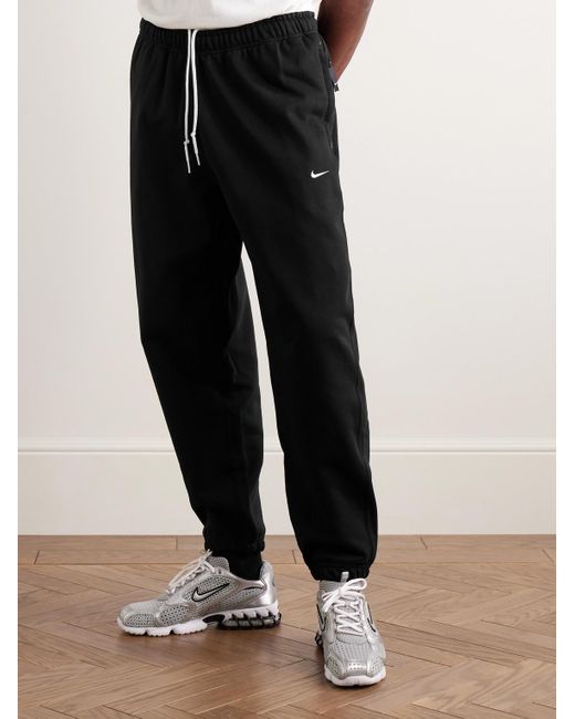 Nike Solo Swoosh schmal zulaufende Jogginghose aus Jersey aus einer Baumwollmischung mit Logostickerei in Black für Herren