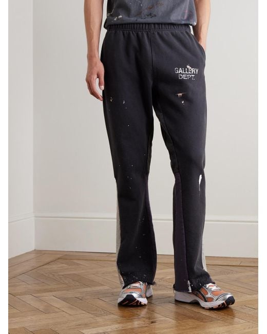 GALLERY DEPT. Blue Flared Paint-Splattered Panelled Logo-Print Cotton-Jersey Sweatpants for men