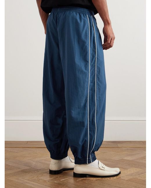 Willy Chavarria Blue Bad Boy Tapered Logo-Embroidered Piped Shell Trackpants for men