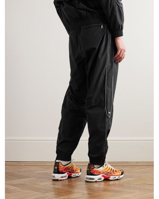 Nike Black Solo Swoosh Tapered Logo-embroidered Taffeta Track Pants for men
