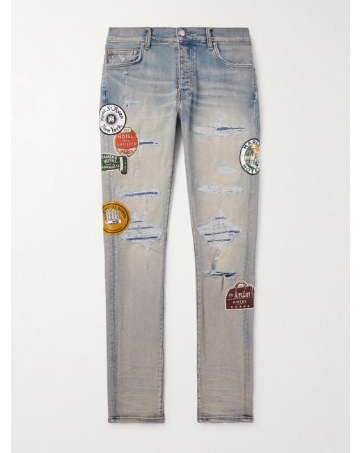 Amiri Blue Slim-fit Appliquéd Distressed Jeans for men