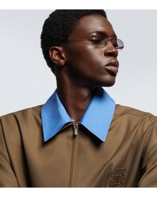 Miu Miu Ovale Sonnenbrille in Metallic für Herren