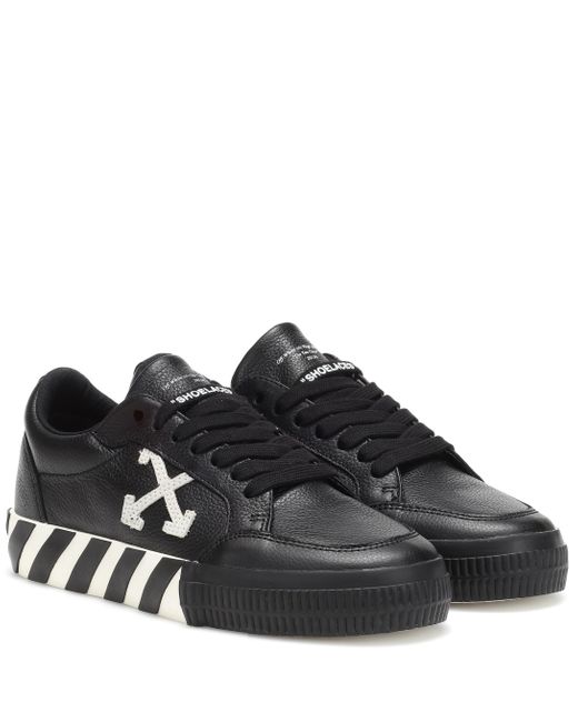 Off-White c/o Virgil Abloh *icon Black Vulcanized Leather Sneakers With Diagonal Stripes On The Sole And Arrows On The Side.