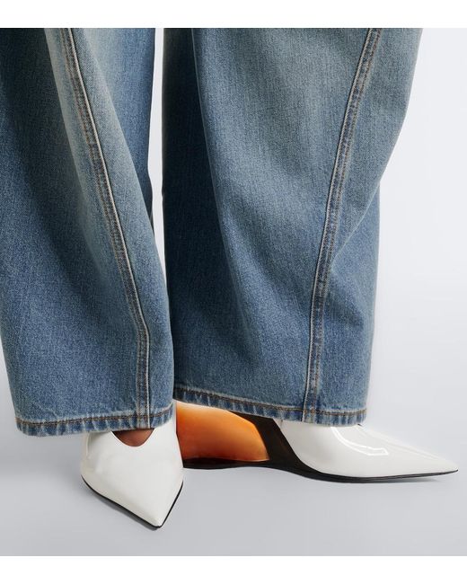 Alaïa White Invisible Leather Wedge Pumps