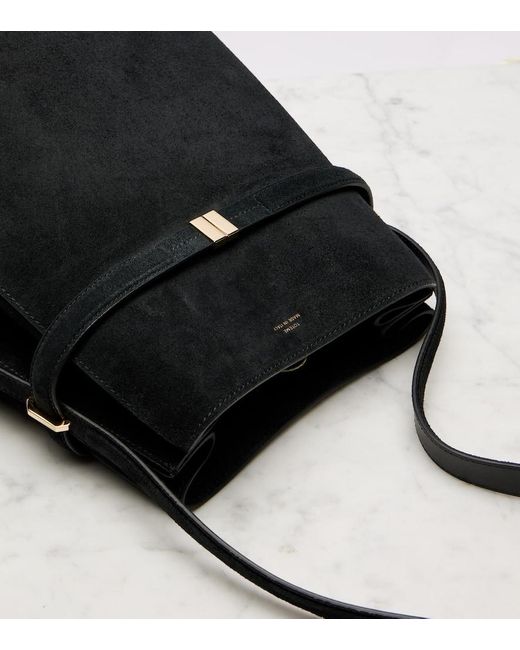 Sac Seau En Daim Totême  en coloris Black
