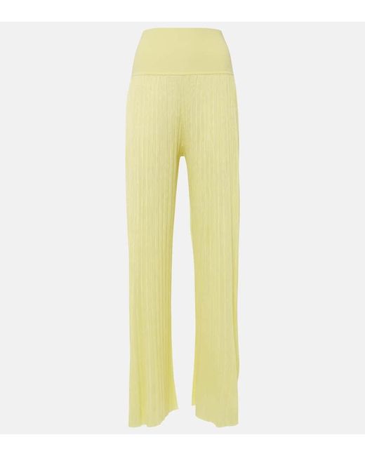 Pantalones rectos plisados de jersey Alaïa de color Yellow