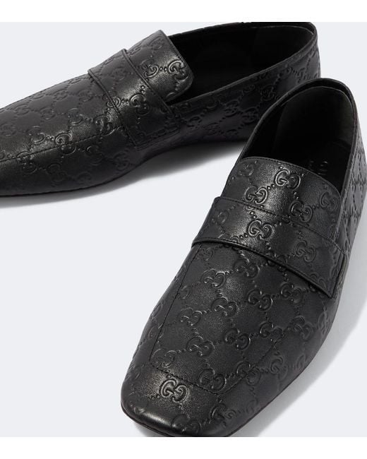 Gucci Black Gg Embossed Leather Loafers for men