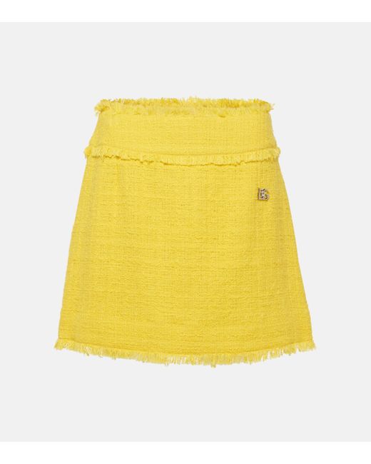 Mini-jupe en tweed de coton melange Dolce & Gabbana en coloris Yellow