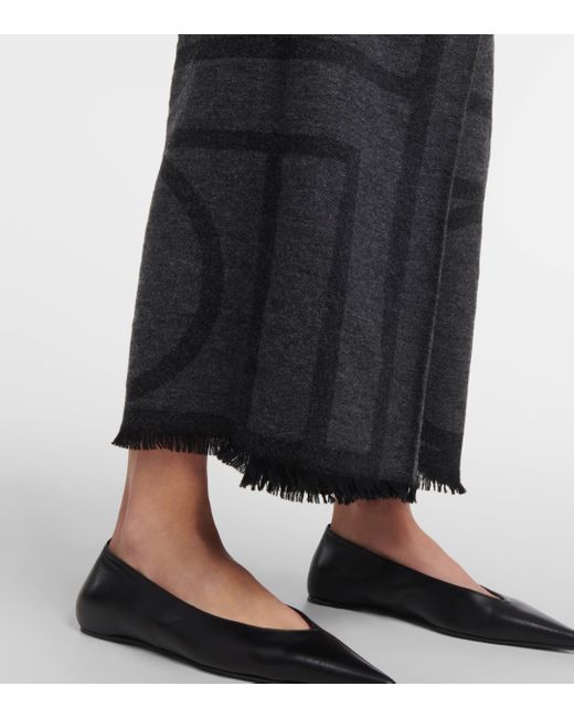 Totême  Black Logo Embroidered Wool Maxi Skirt