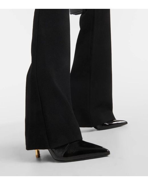 Pantaloni bootcut in crepe di lana vergine di Balmain in Black