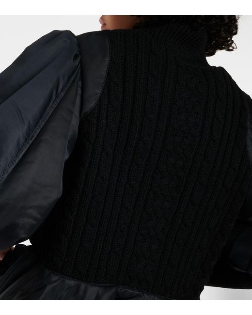 Bomber Peplum in lana e tessuto tecnico di Noir Kei Ninomiya in Black