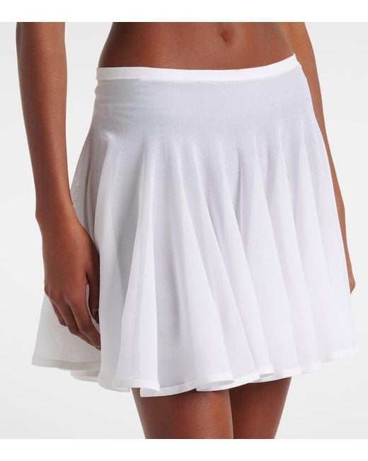 Alaïa White Pleated Semi-Sheer Miniskirt