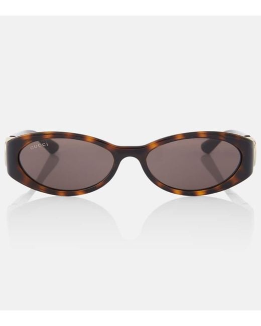 Gafas de sol ovaladas con GG Gucci de color Brown