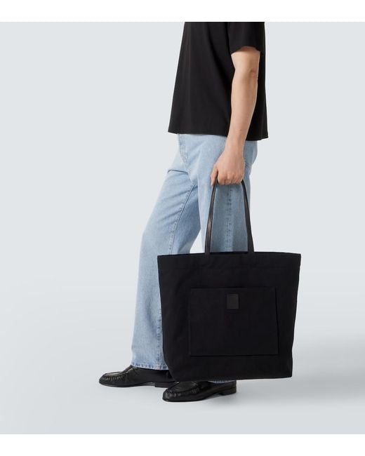 The Row Black Tori Leather-Trimmed Canvas Tote Bag for men