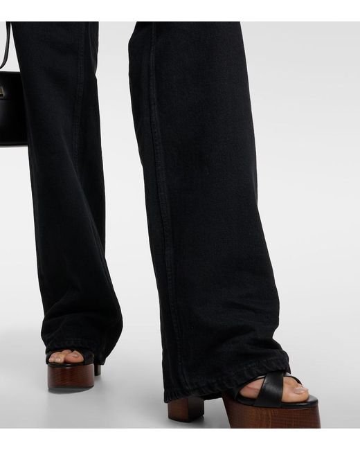 Jeans anchos de tiro alto Saint Laurent de color Black