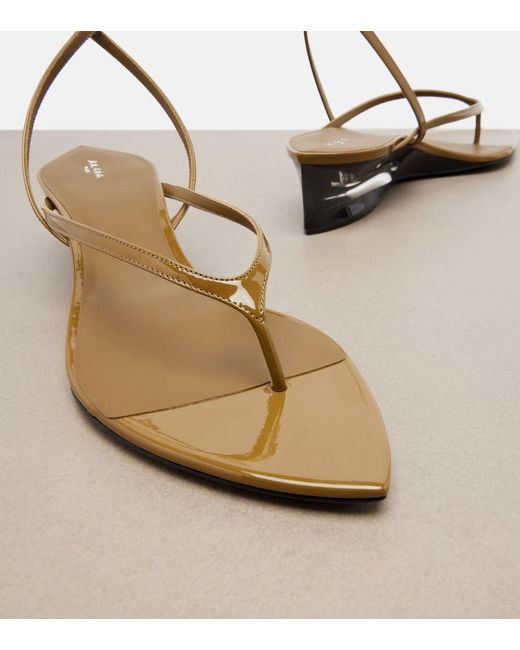 Alaïa Metallic Invisible Patent Leather Wedge Thong Sandals