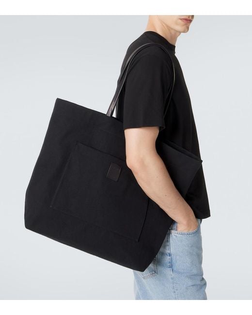 The Row Black Tori Leather-Trimmed Canvas Tote Bag for men