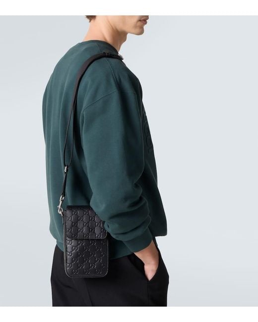 Gucci Black Gg Emblem Debossed Leather Phone Pouch for men
