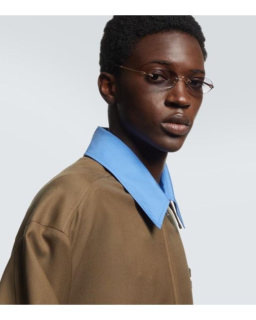 Miu Miu Ovale Sonnenbrille in Metallic für Herren
