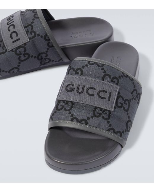 Claquettes matelassées GG Damier Gucci pour homme en coloris Black