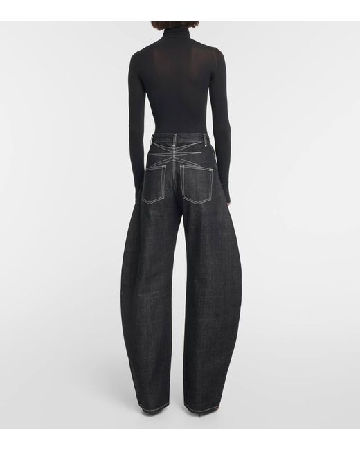 Jeans a gamba larga e vita alta di Alaïa in Black