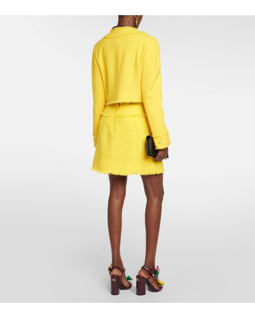 Mini-jupe en tweed de coton melange Dolce & Gabbana en coloris Yellow