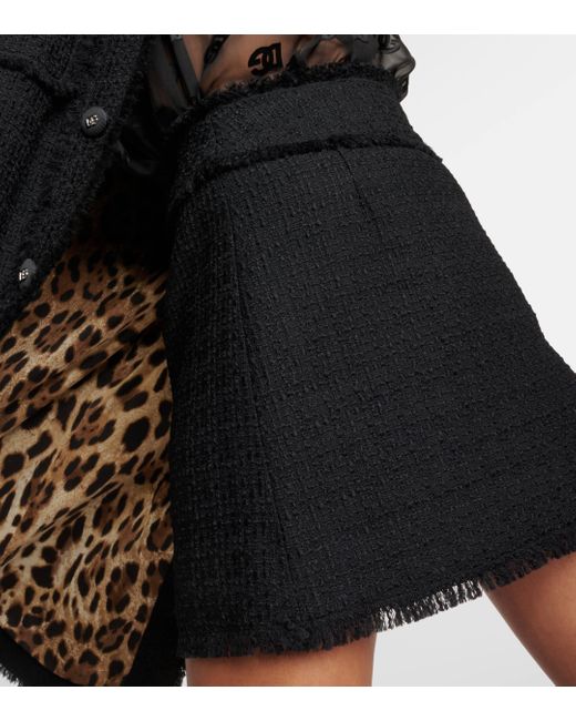 Mini-jupe en tweed de laine melangee Dolce & Gabbana en coloris Black