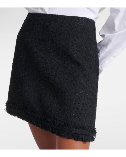 Mini-jupe en tweed Versace en coloris Black
