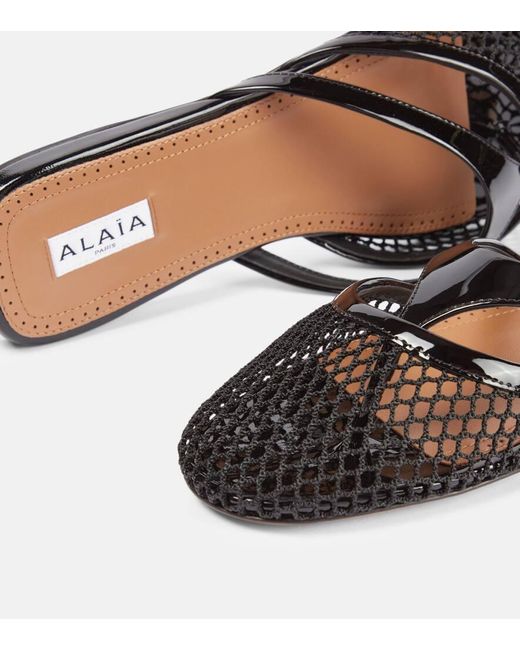 ALAIA FLAT MULES IN COPPER BROWN MESH FISHNET