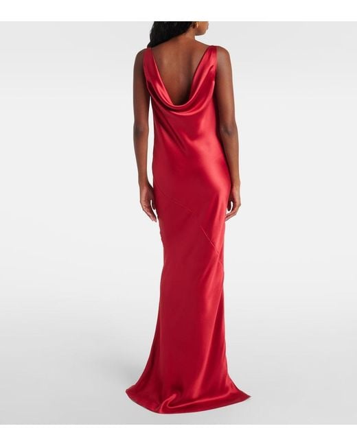versace red dress Sequin-trimmed draped silk-satin gown - reflecting its enduring ethos of confident Anne-Hathaway-red-dress-Front-Row-Versace-Fall-2024