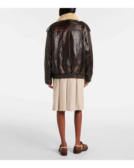 Veste En Cuir Et Shearling A Logo Miu Miu en coloris Black