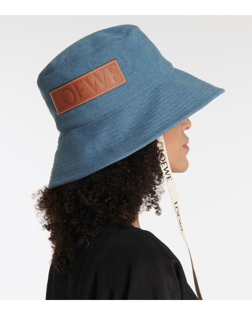 + Paula's Ibiza leather-trimmed frayed denim bucket hat