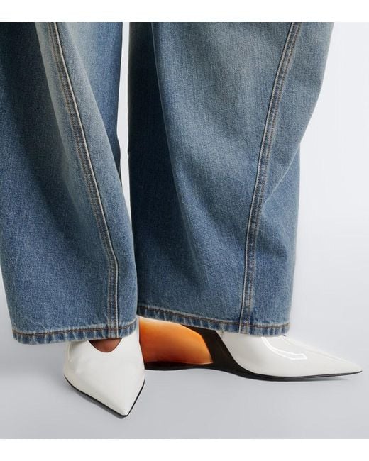 Alaïa White Invisible Leather Wedge Pumps