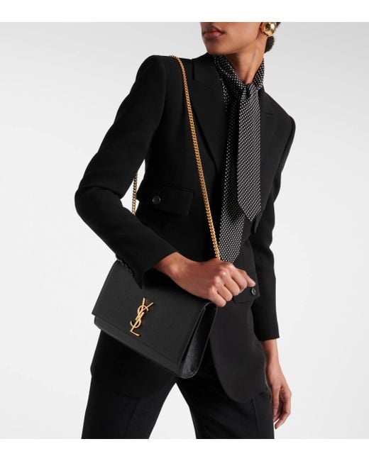 Sac a bandouliere Kate Medium en cuir embosse Saint Laurent en coloris Black