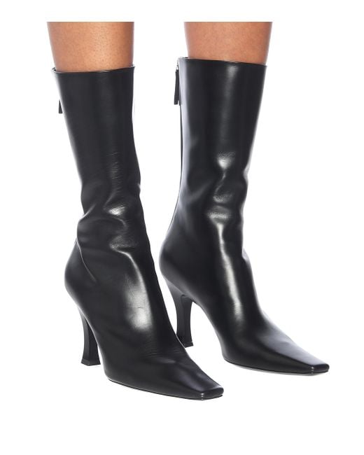 The Row Office Leather Ankle Boots in Black Lyst