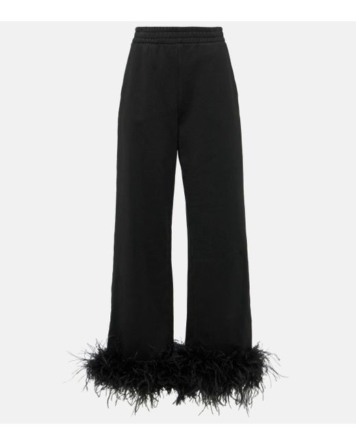 Pantalon de survetement en coton a plumes Prada en coloris Black