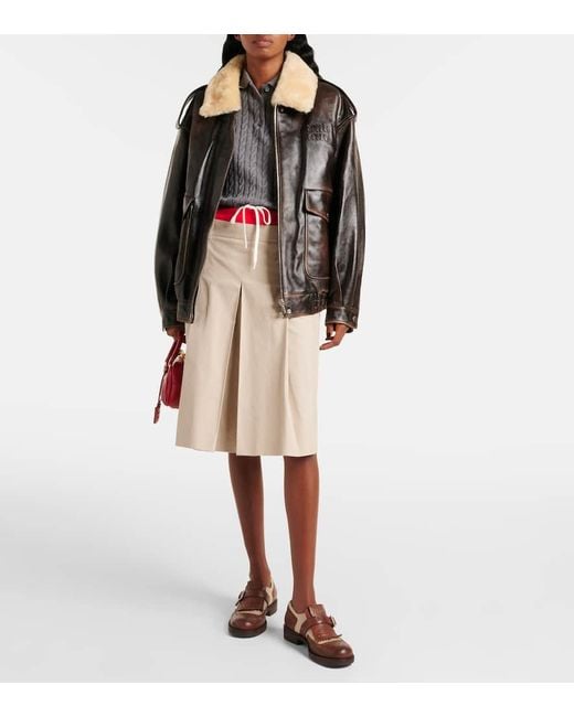 Veste En Cuir Et Shearling A Logo Miu Miu en coloris Black
