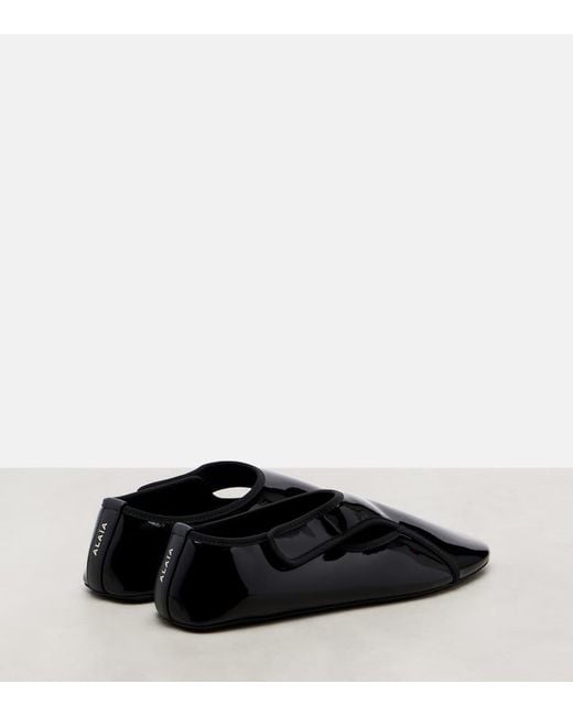 Ballerines Criss Cross En Cuir Alaïa en coloris Black